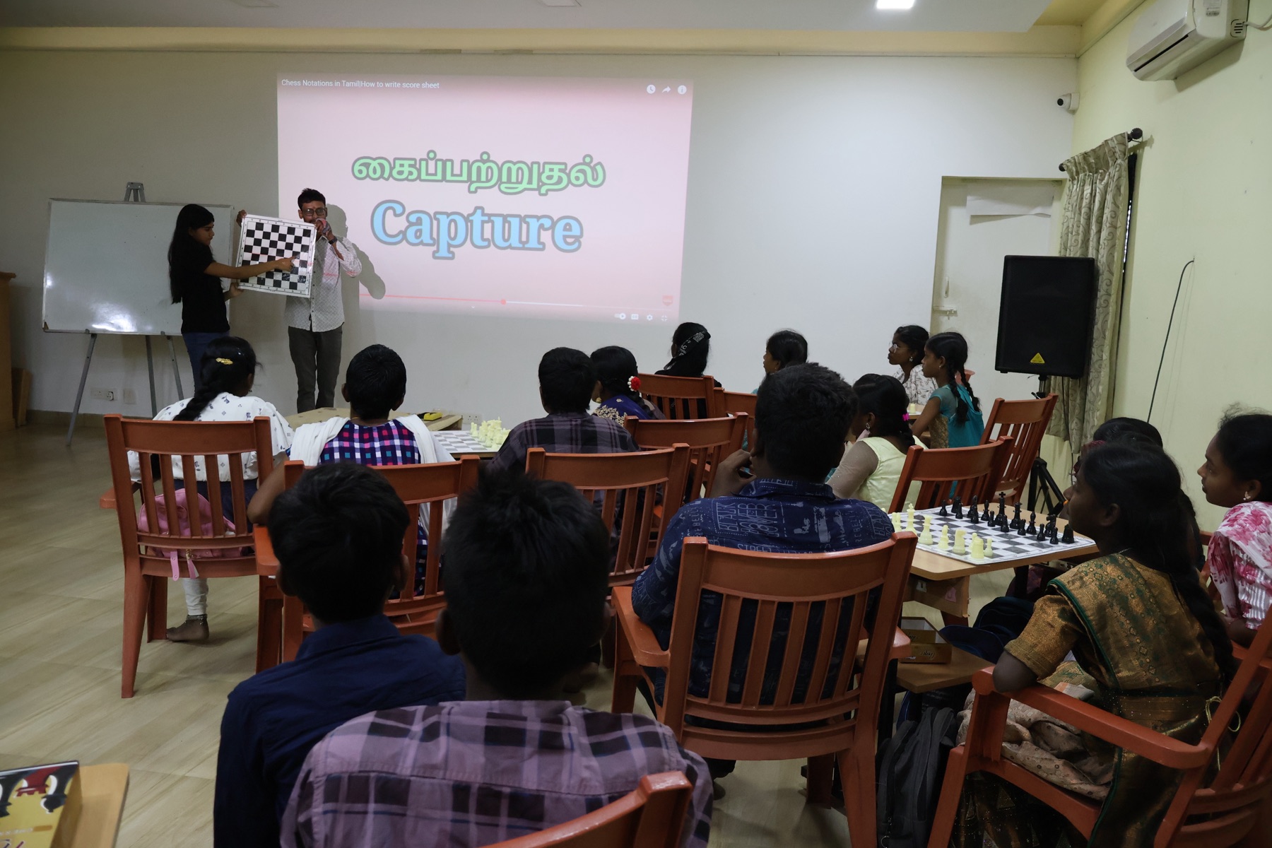 The "capture" lesson, taught in Tamil so every student could follow.